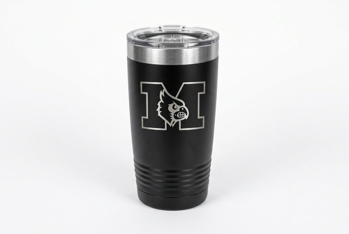 A black insulated stainless steel tumbler with a silver lid, featuring a white and red 'M' logo with a wild horse graphic on the front, set against a light beige background.